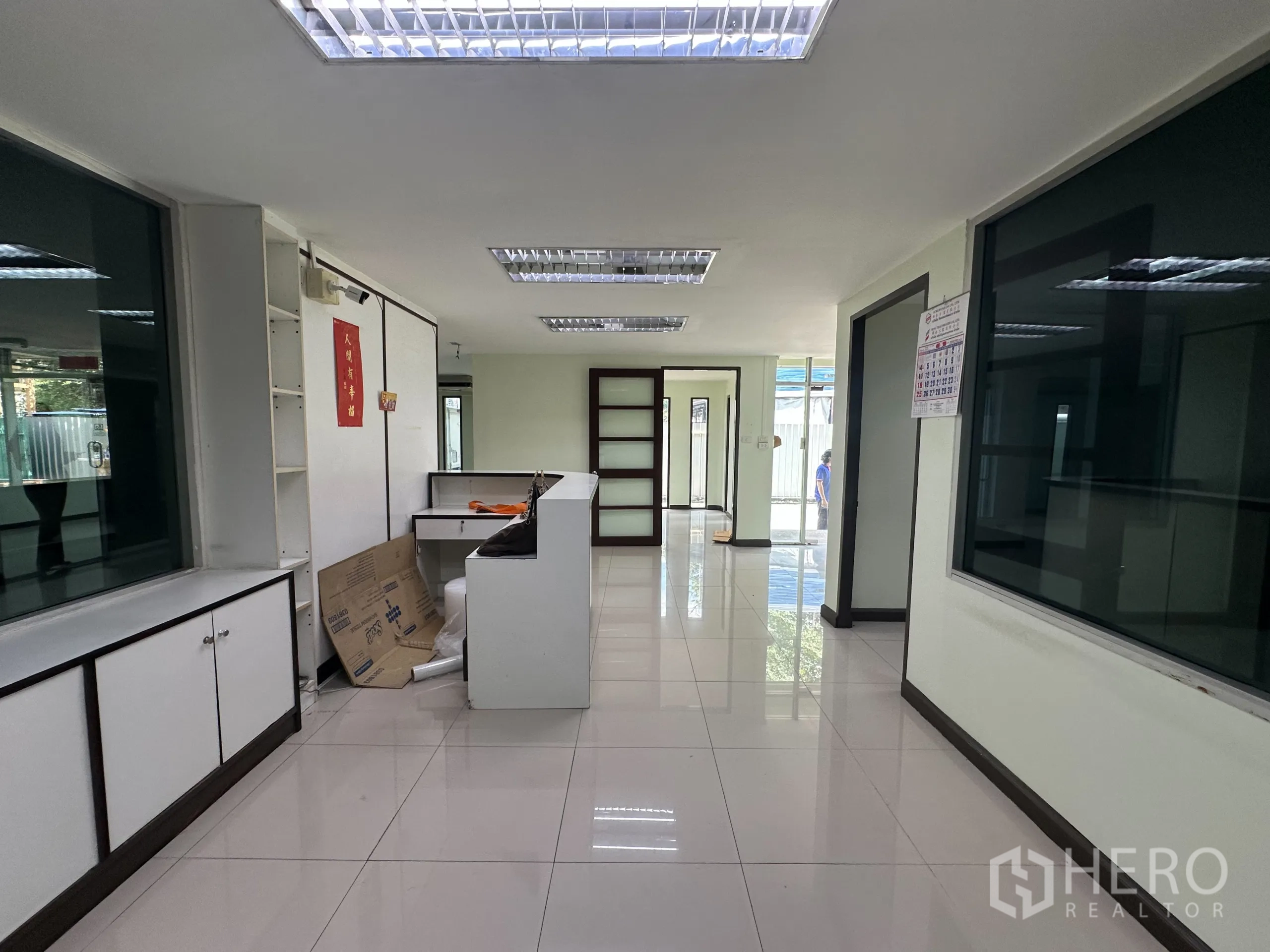 Retail Space for rent in Watthana, Bangkok - Bright ground-floor office zone with built-in cabinets and glass partitions.