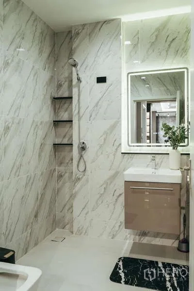 Detached House for sale in Sai Mai, Bangkok - Walk‑in shower bathroom with backlit mirror and floating vanity.