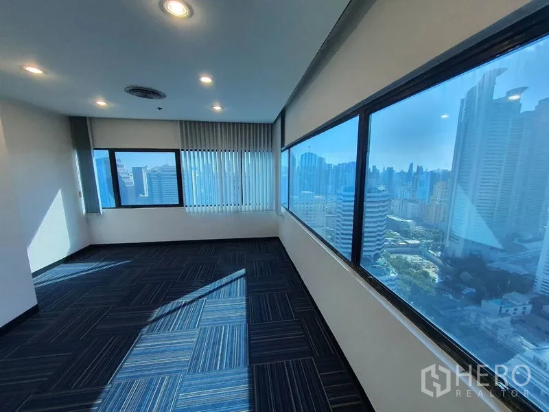 Office Space for rent in Watthana, Bangkok - Corner executive room with wide windows offering panoramic Bangkok skyline views.