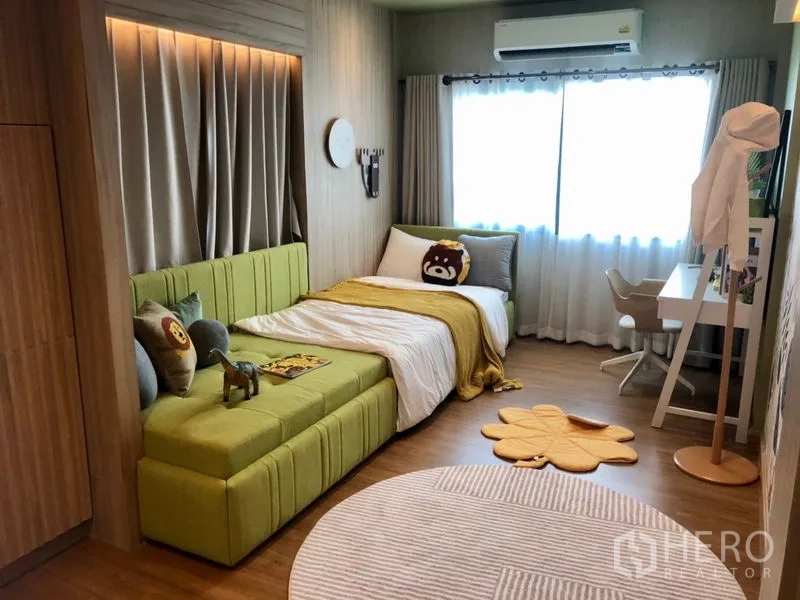 Detached House for sale - Children’s bedroom with green daybed, single bed, study desk, air conditioner and large window.