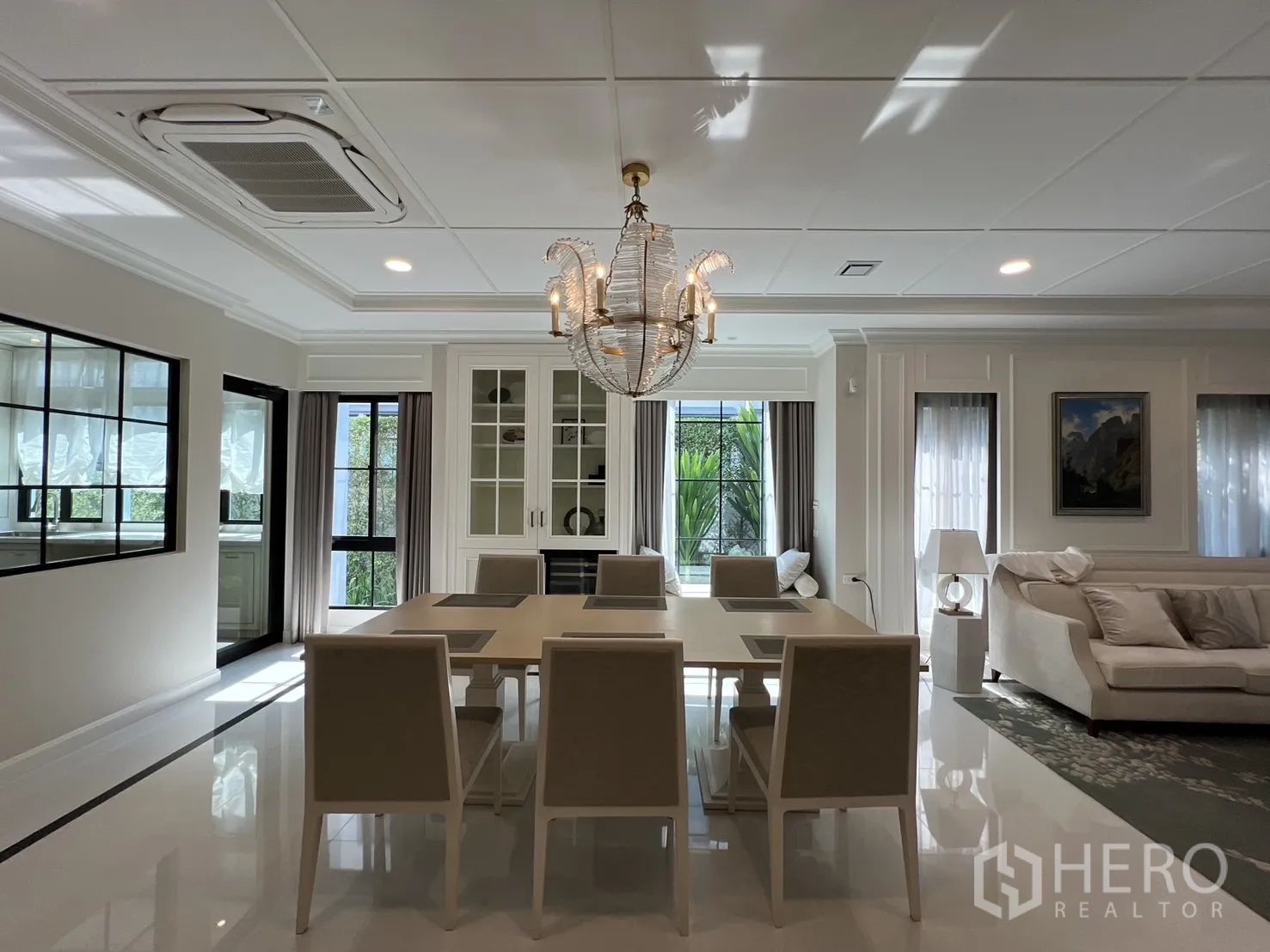 Detached House for rent in Saphan Sung, Bangkok - Dining area centered under crystal chandelier with natural light.
