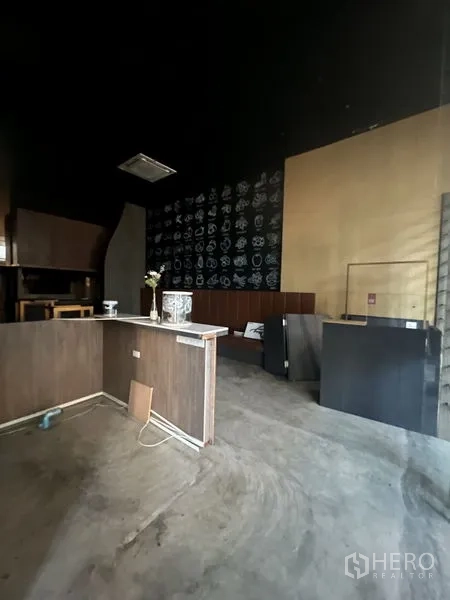 Retail Space for rent in Watthana, Bangkok - High-ceiling retail space featuring a reception counter and patterned accent wall.