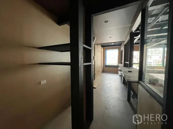 Retail Space for rent in Phaya Thai, Bangkok - Narrow service corridor with open shelving and built-in work counters, suitable for back-of-house use.