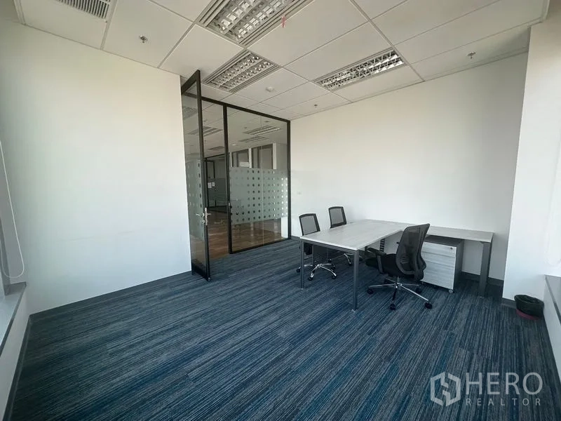 Office Space for rent in Ratchathewi, Bangkok - Quiet private office with blue carpet and two desks.