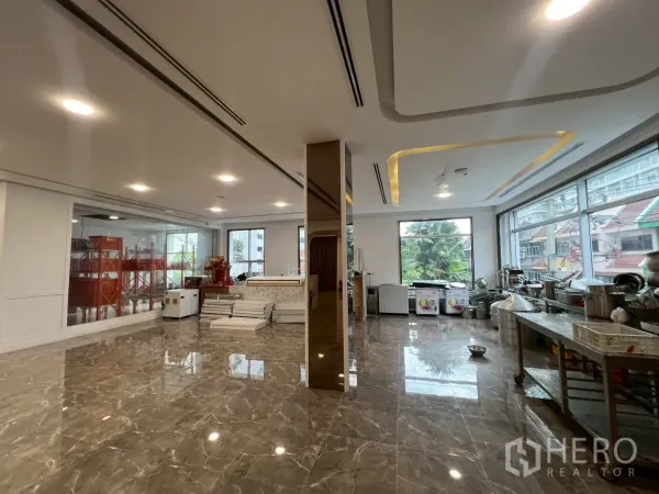 Retail Space for rent in Watthana, Bangkok - Open-plan retail area with large windows, recessed ceiling lights and stainless prep tables