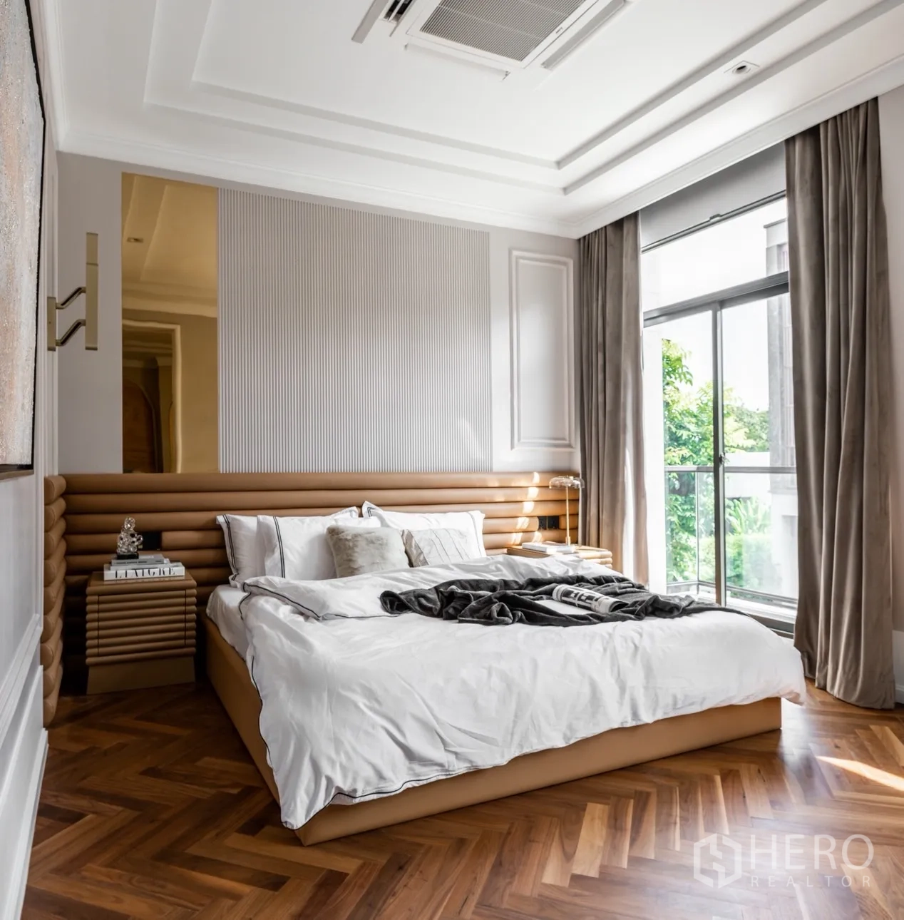 Detached House for rent or sale in Phra Khanong, Bangkok - Alternate view of the master bedroom showing large glazing and herringbone floors.