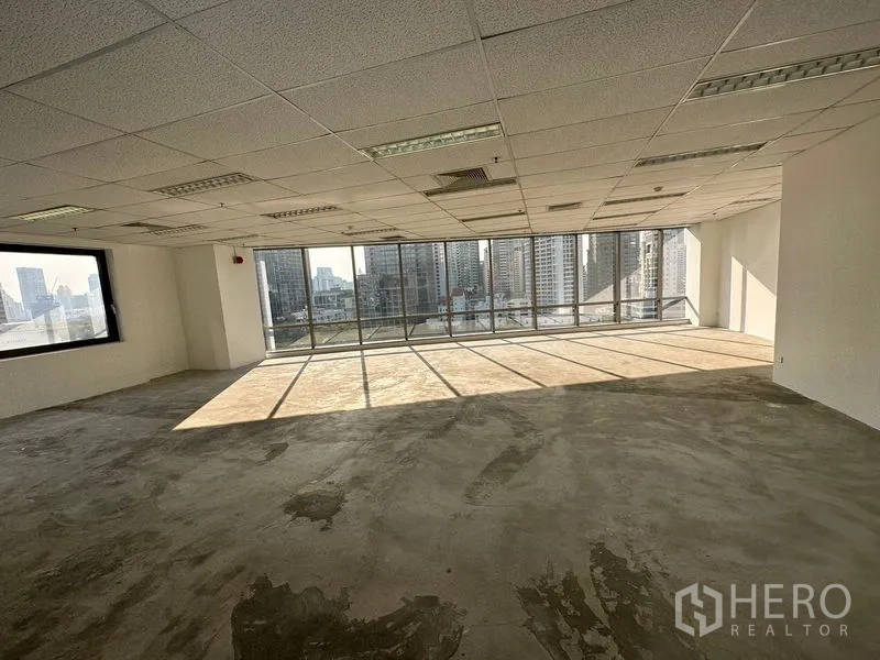 Office Space for rent - Sunlit vacant office space with panoramic glazing and concrete subfloor ready for fit-out.