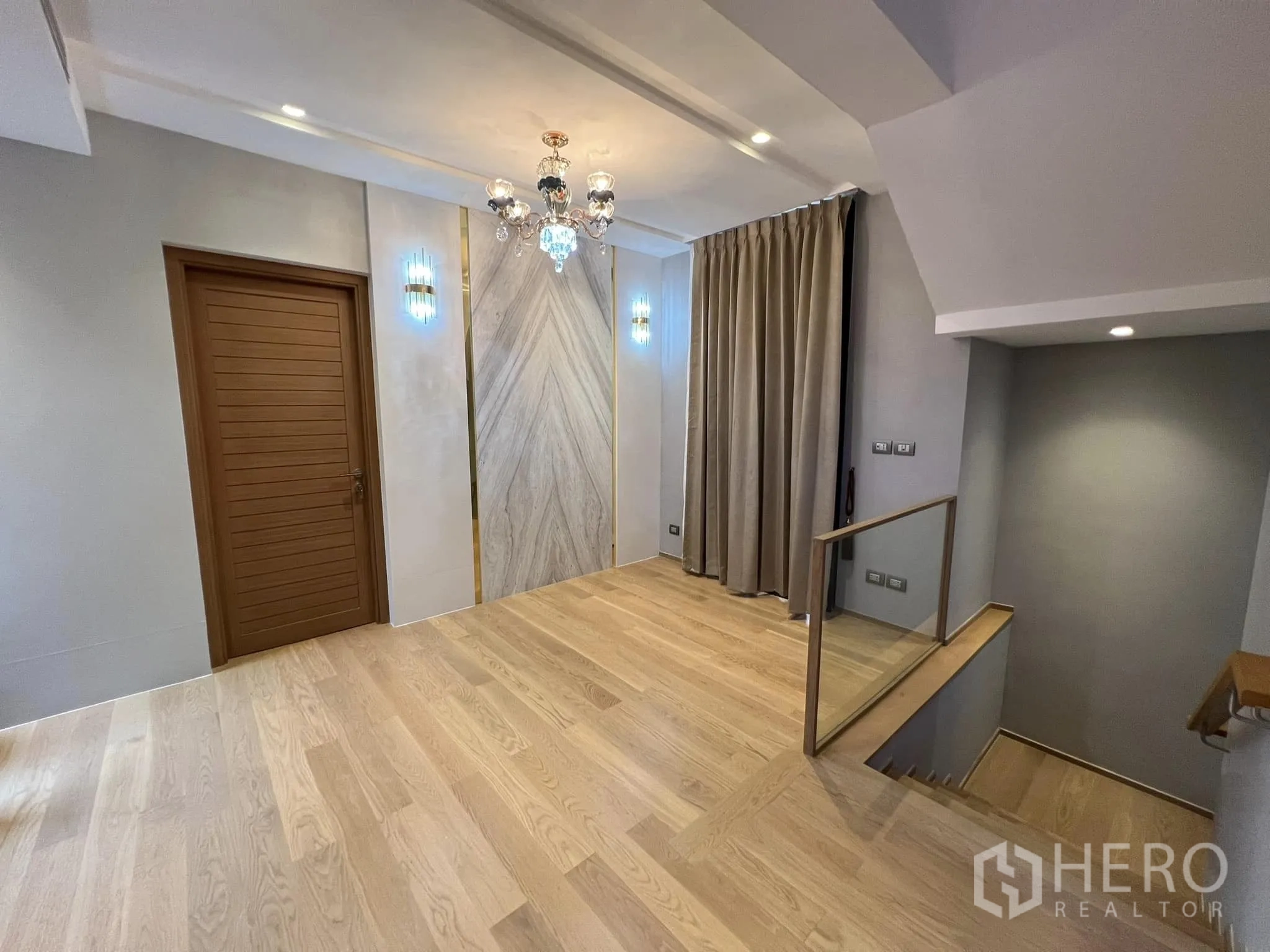 Detached House for rent or sale in Yan Nawa, Bangkok - Upper landing with statement chandelier and staircase.