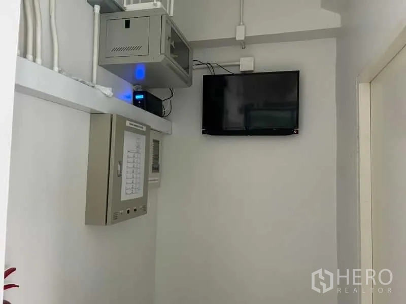 Office Space for rent in Bang Rak, Bangkok - Control room with electrical panel, network cabinet and wall-mounted screen.
