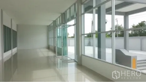 Factory for rent or sale in Bang Sao Thong, Samut Prakan - Bright lobby with floor-to-ceiling windows and covered entrance.