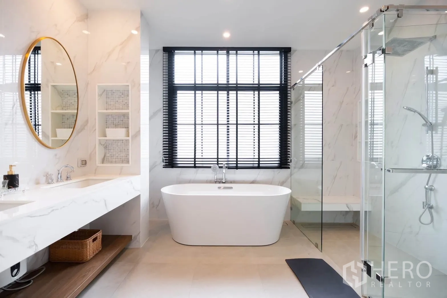 Detached House for rent or sale in Bang Kapi, Bangkok - Bathroom with freestanding bathtub, glass shower enclosure, and large window with blinds.