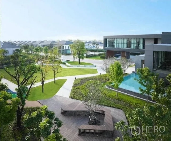 Detached House for rent in Bang Phli, Samut Prakan - Community clubhouse with pool and landscaped park within the estate.