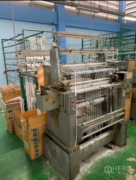 Warehouse for sale in Mueang Samut Sakhon, Samut Sakhon - Close-up of an industrial weaving machine inside the warehouse production area.
