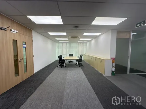 Office Space for rent - Conference zone in Lat Krabang office featuring wood doors, frosted glass and natural light.