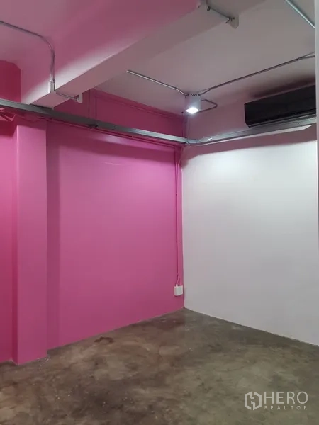 Home Office for sale in Khlong Toei, Bangkok - Pink accent room with polished concrete flooring and air conditioning.