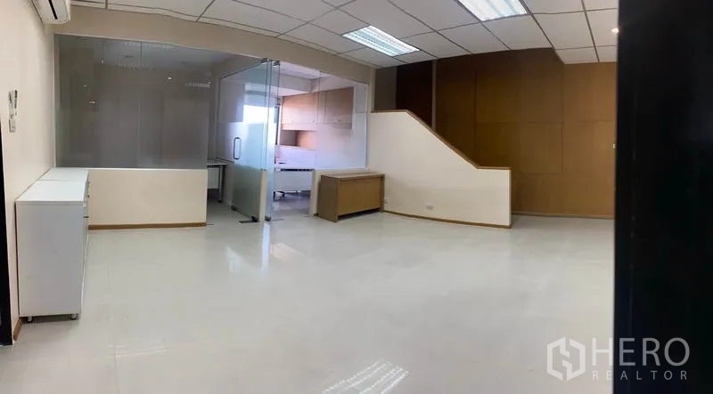 Office Space for rent in Din Daeng, Bangkok - Bright reception and workspace with glossy floor, glass-partition meeting room and wood wall panel.