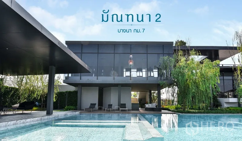 Detached House for rent in Samut Prakan - Modern clubhouse exterior with a large swimming pool.
