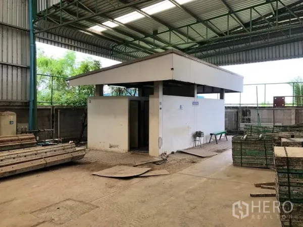 Factory for rent or sale in Lat Lum Kaeo, Pathum Thani - Covered utility building with restrooms within the warehouse yard.