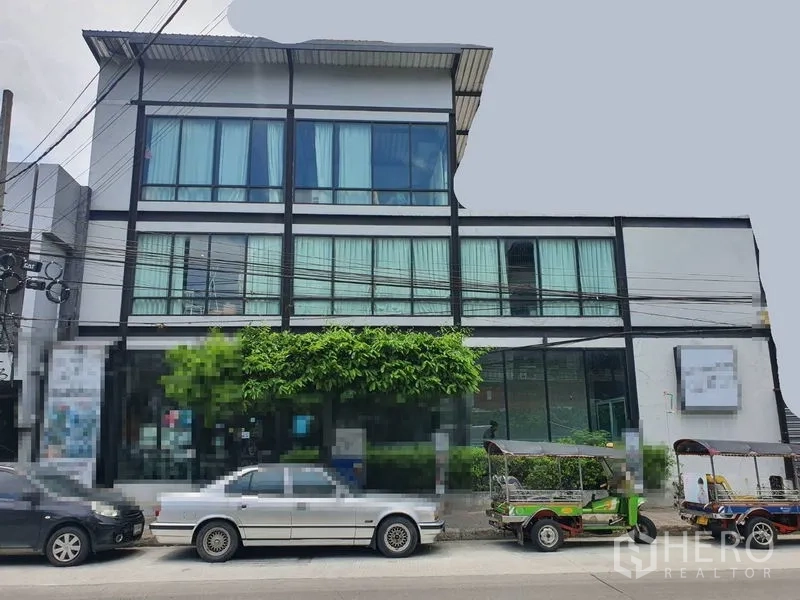 Retail Space for rent in Sathon, Bangkok - Modern three-storey commercial building with large glass frontage and street parking in Sathon.