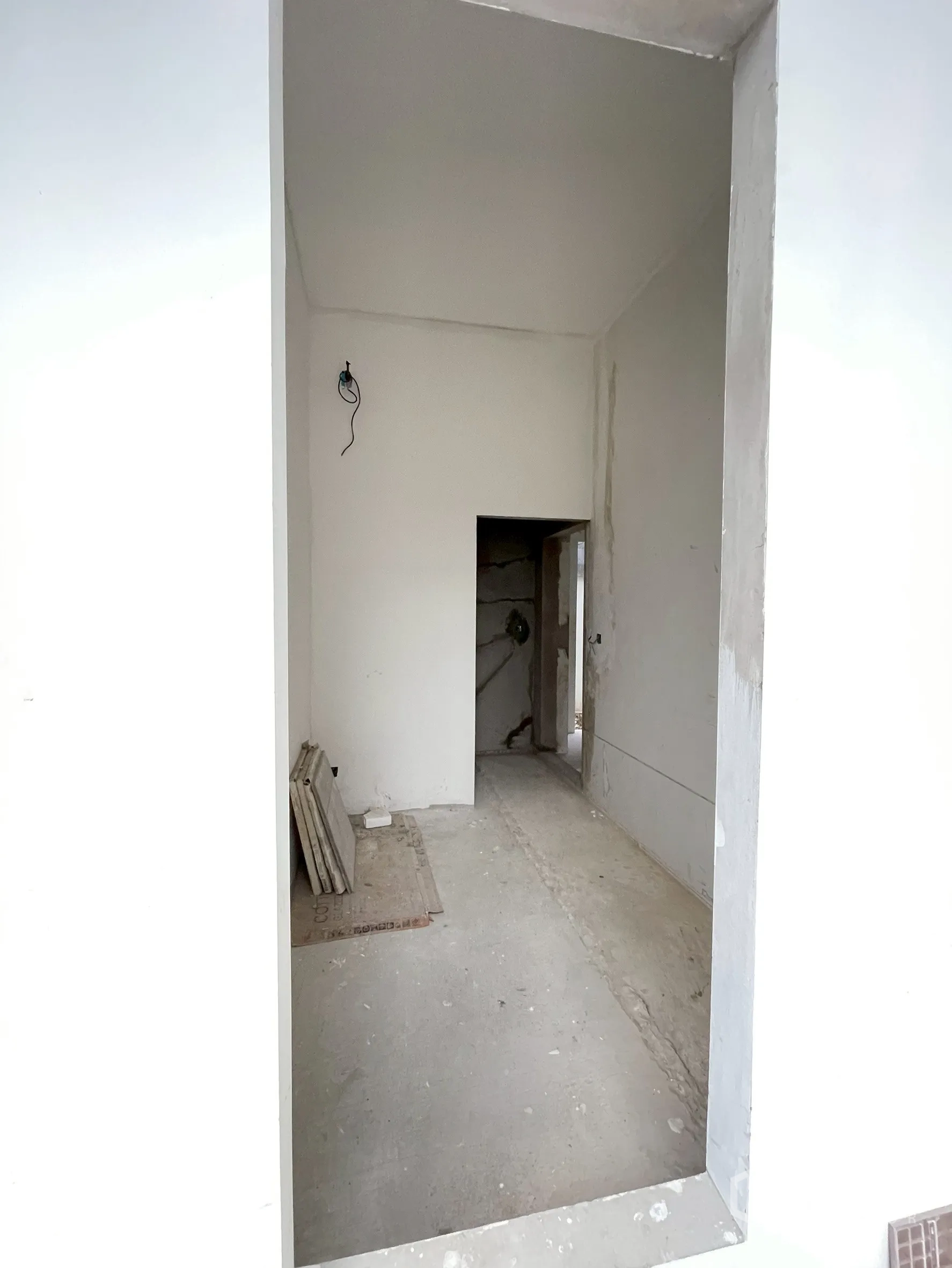 Detached House for sale in Bang Phli, Samut Prakan - Unfinished interior corridor with bare walls and doorway openings.