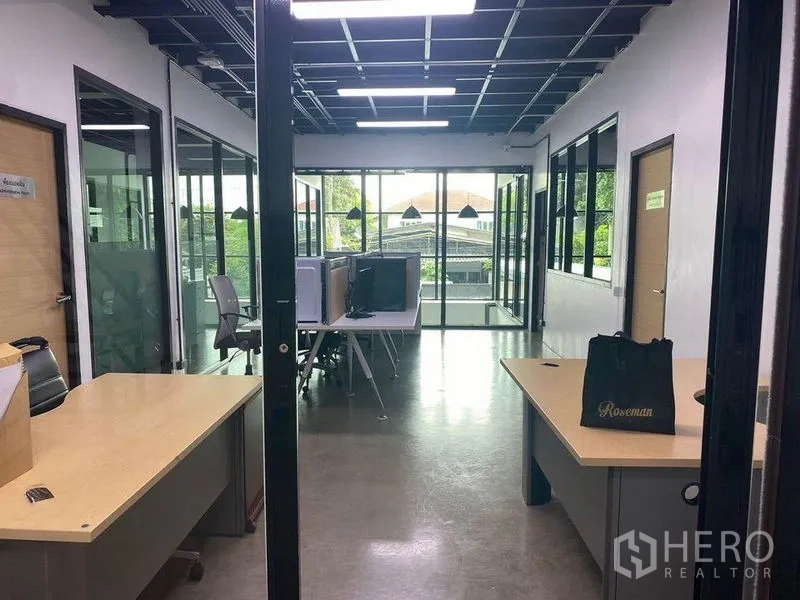 Home Office for rent or sale in Bang Khae, Bangkok - Open-plan workspace with glass partitions, desks and floor-to-ceiling windows.