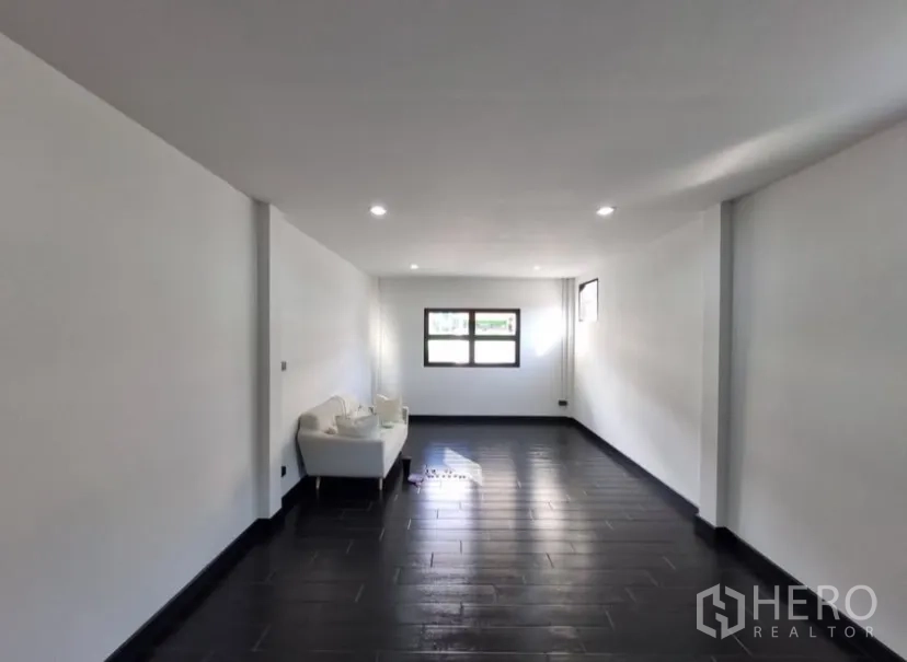 Detached House for rent in Suan Luang, Bangkok - Multipurpose room with dark floor tiles, bright windows and a small sofa.