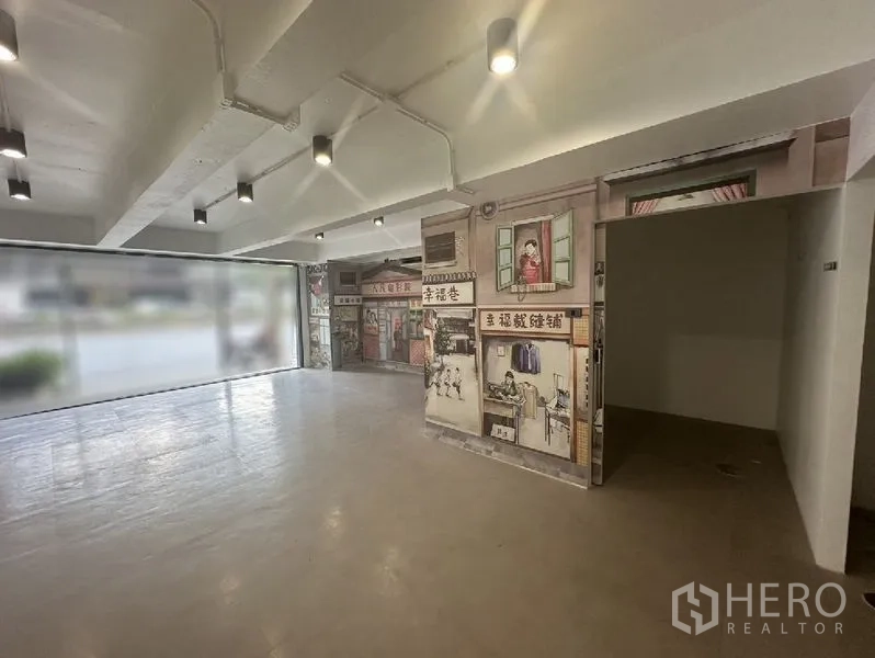Retail Space for rent in Bang Rak, Bangkok - Retail area with ceiling spotlights, floor-to-ceiling glass frontage and a decorative mural partition.
