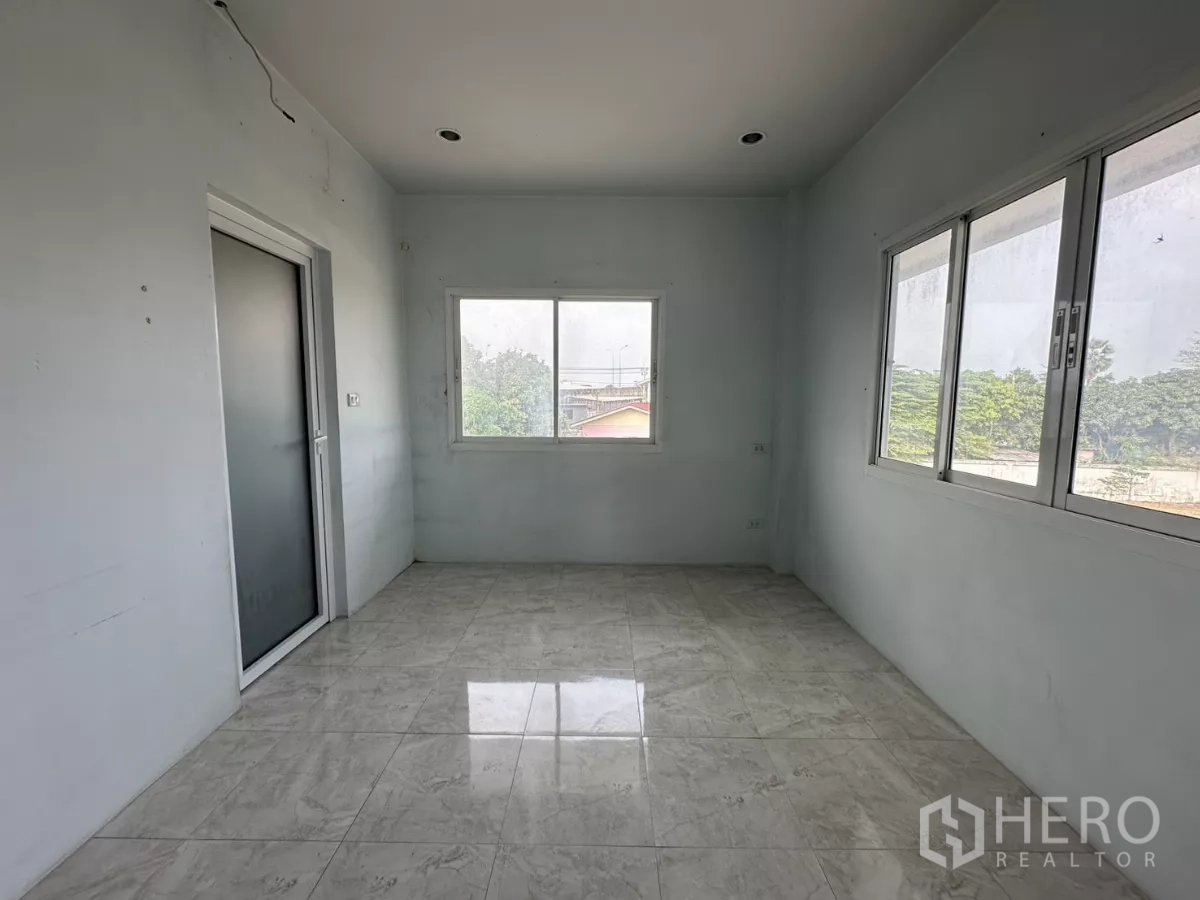 Home Office for rent - Bright corner room with tall narrow windows and possible balcony access.