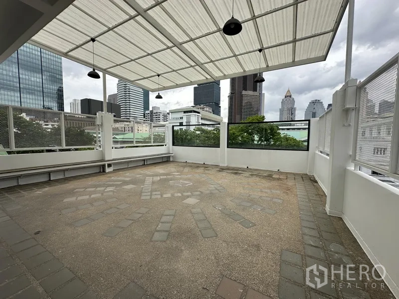 Retail Space for rent in Bang Rak, Bangkok - Canopied terrace with mesh railings and pendant lights.