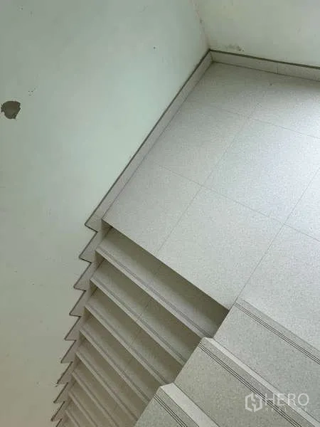 Home Office for sale in Bang Phli, Samut Prakan - Close-up of tiled stair landing and steps showing durable finish in the building.