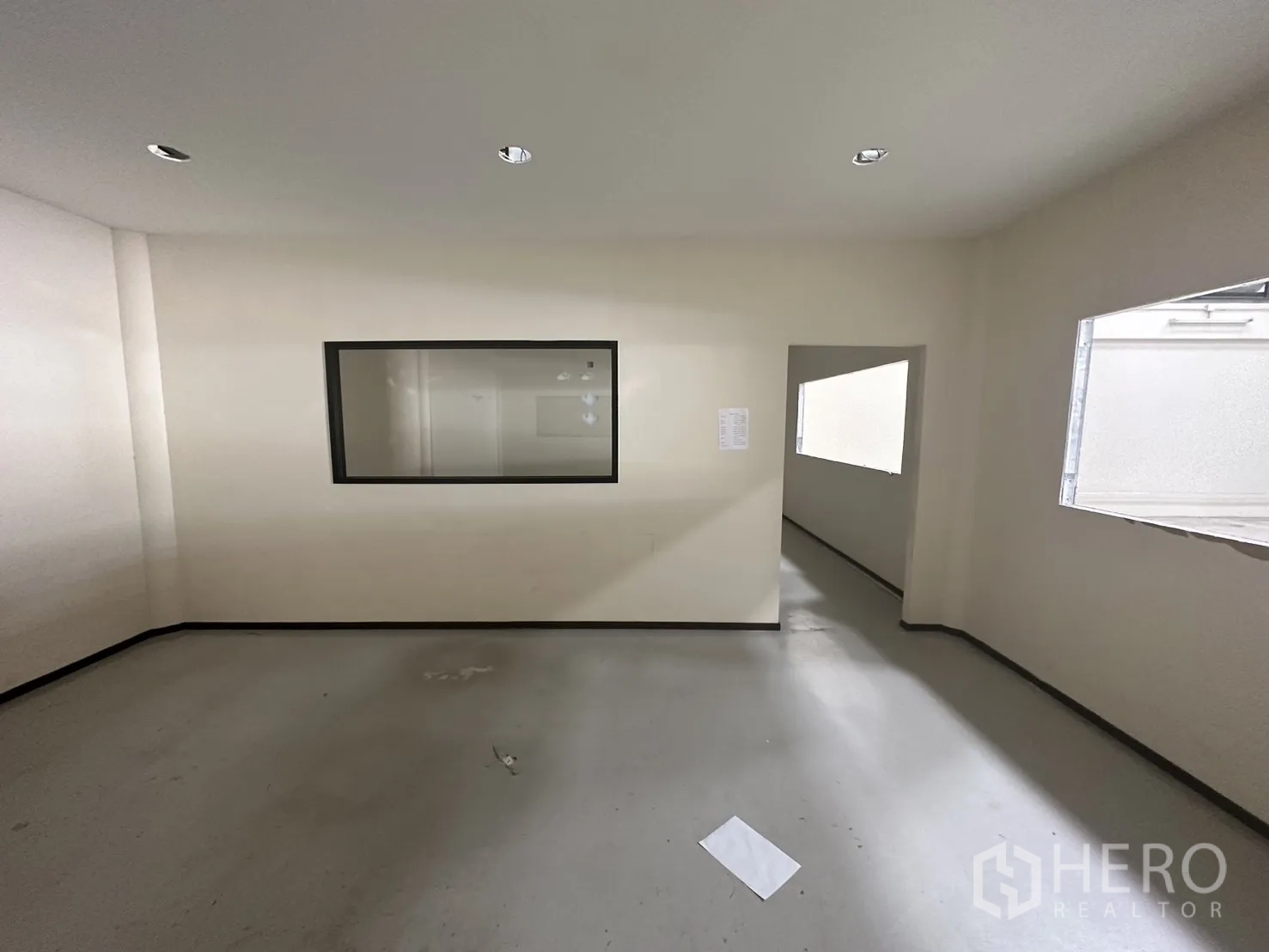 Warehouse for rent in Suan Luang, Bangkok - Bright office with windows and corridor inside the warehouse complex.