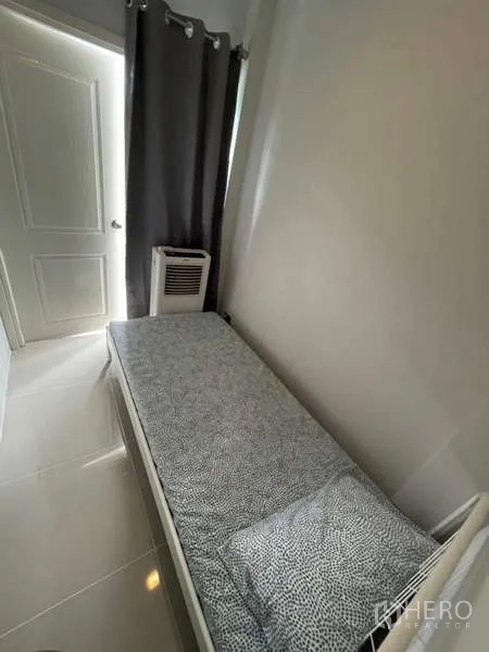 Detached House for rent or sale in Lat Krabang, Bangkok - Compact maid’s room with a single bed and window for natural light.