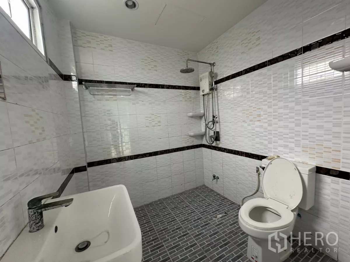 Home Office for rent - Spacious bedroom with wide window and entry doorway.