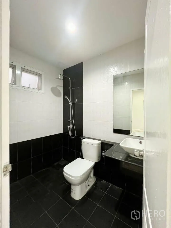Home Office for rent in Bueng Kum, Bangkok - Another bathroom view showing shower, toilet and dark floor tiles