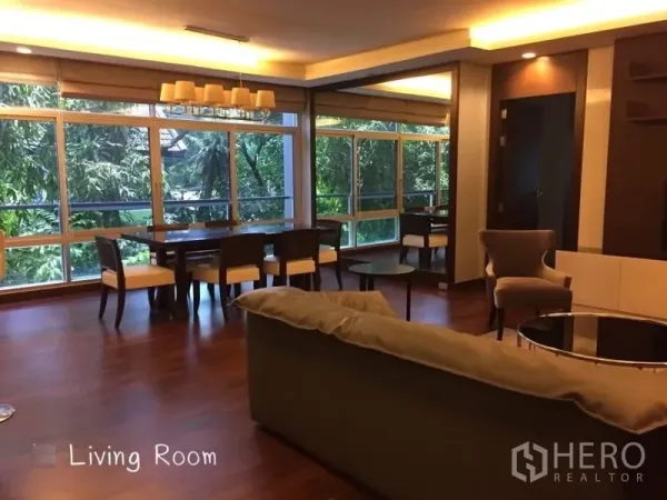Condominium for rent in Sathon, Bangkok - Open-plan living and dining with panoramic windows and leafy views.