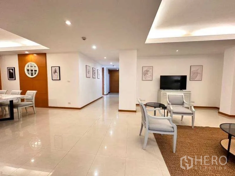 Apartment for rent - Wide living zone with TV console, seating set and glossy tiled floors.