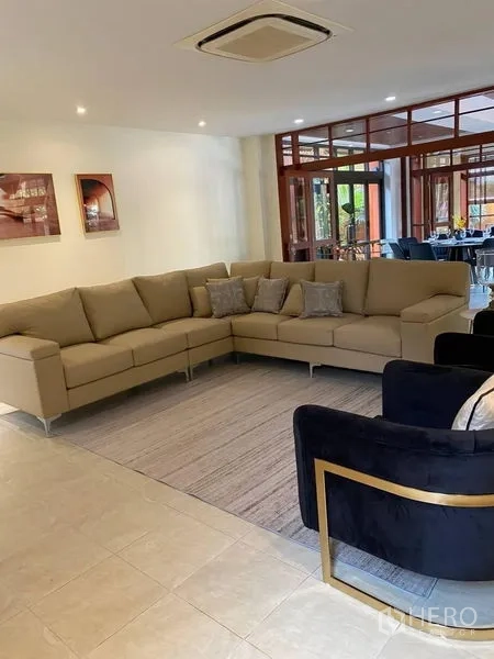 Detached House for rent in Suan Luang, Bangkok - TV lounge with beige sectional, armchairs and ceiling cassette air conditioner.