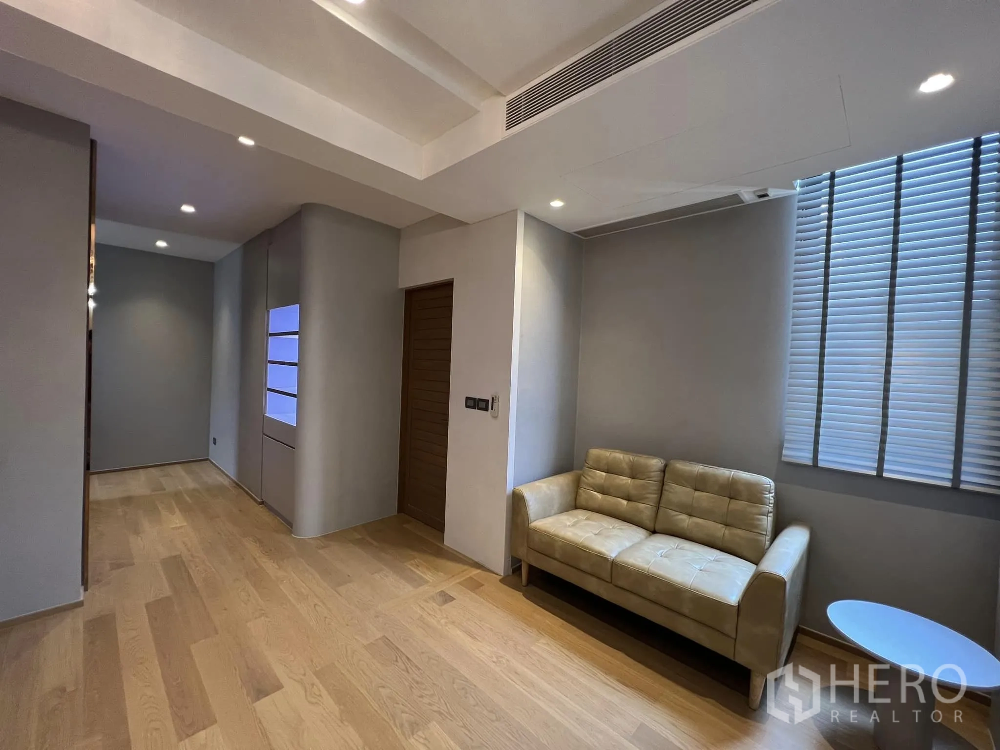 Detached House for rent or sale in Yan Nawa, Bangkok - Bedroom suite sitting area with sofa and wood flooring.