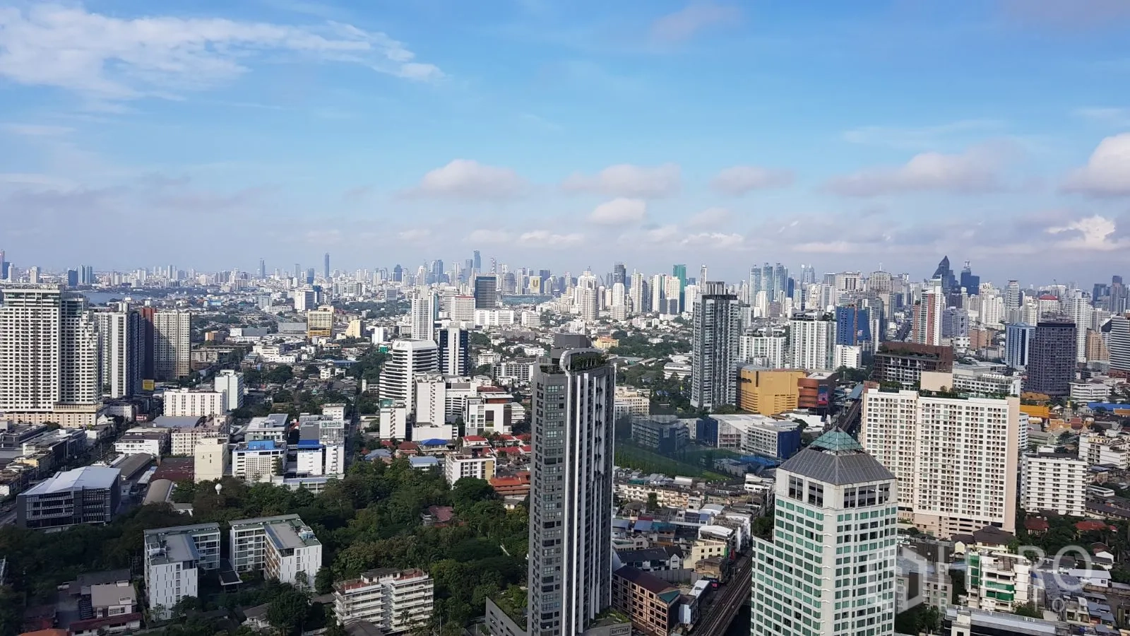 Condominium for rent in Watthana, Bangkok - Panoramic daytime skyline view of Bangkok from a high-floor condominium.