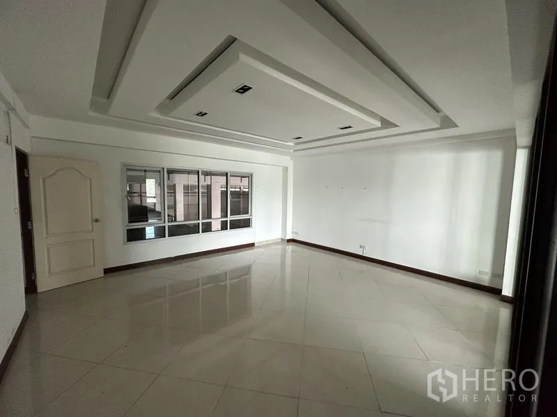 Factory for rent or sale in Bang Bua Thong, Nonthaburi - Bright office room with recessed ceiling design and glossy tiled flooring.