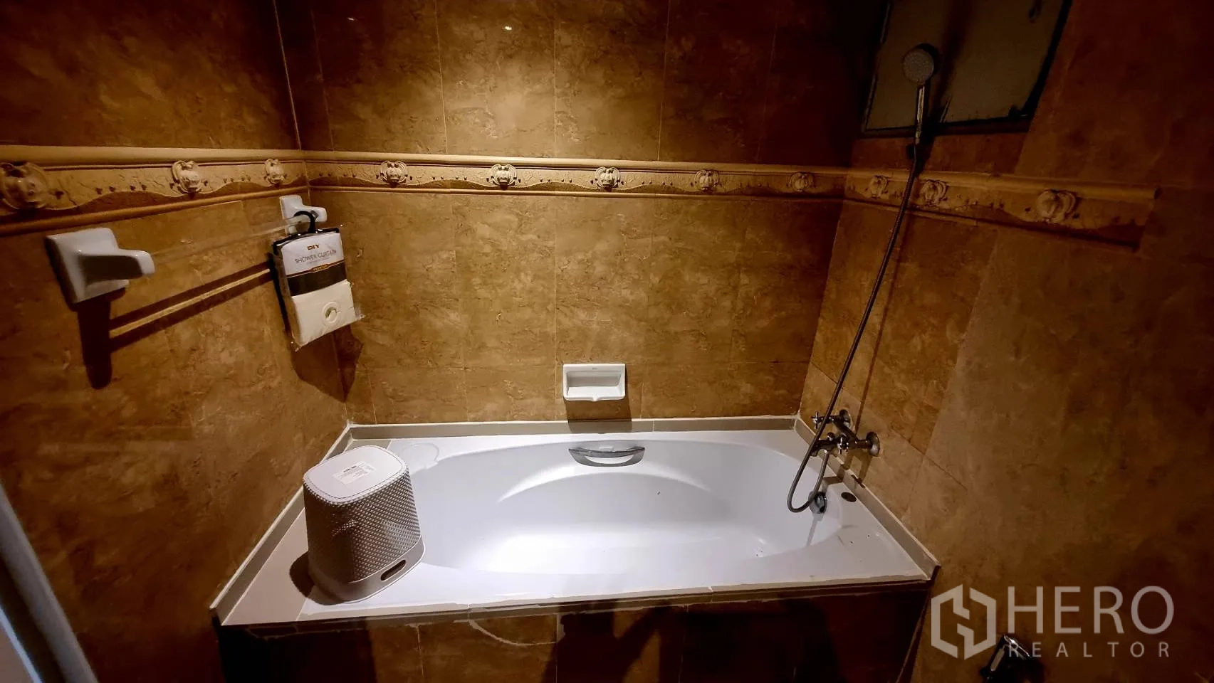 Condominium for rent in Watthana, Bangkok - Balcony view overlooking nearby buildings and street below.