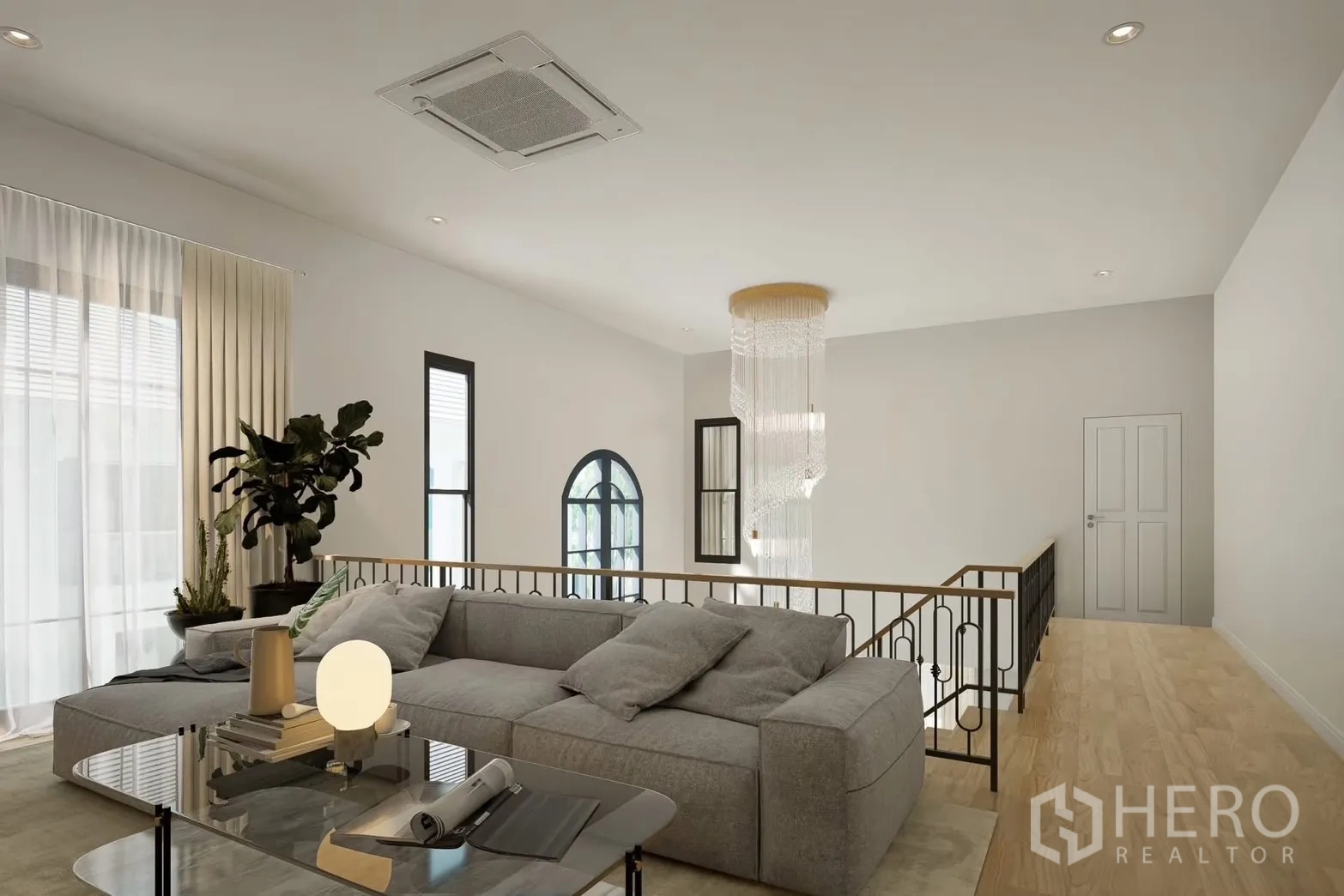 Detached House for rent in Bang Phli, Samut Prakan - Upstairs lounge with sectional sofa and cascading chandelier.