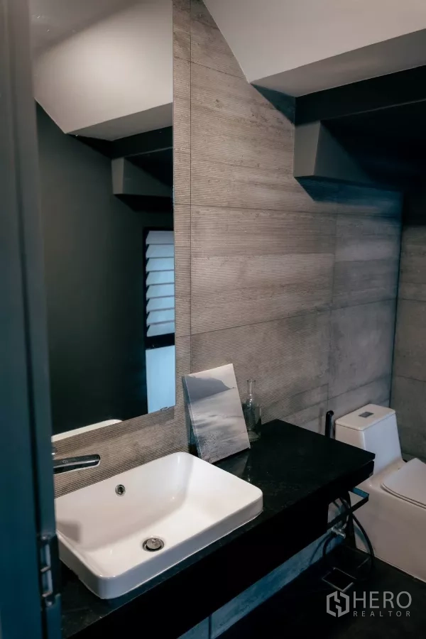 Detached House for rent or sale in Bang Phli, Samut Prakan - Powder room with square basin, black countertop and gray wall tiles.