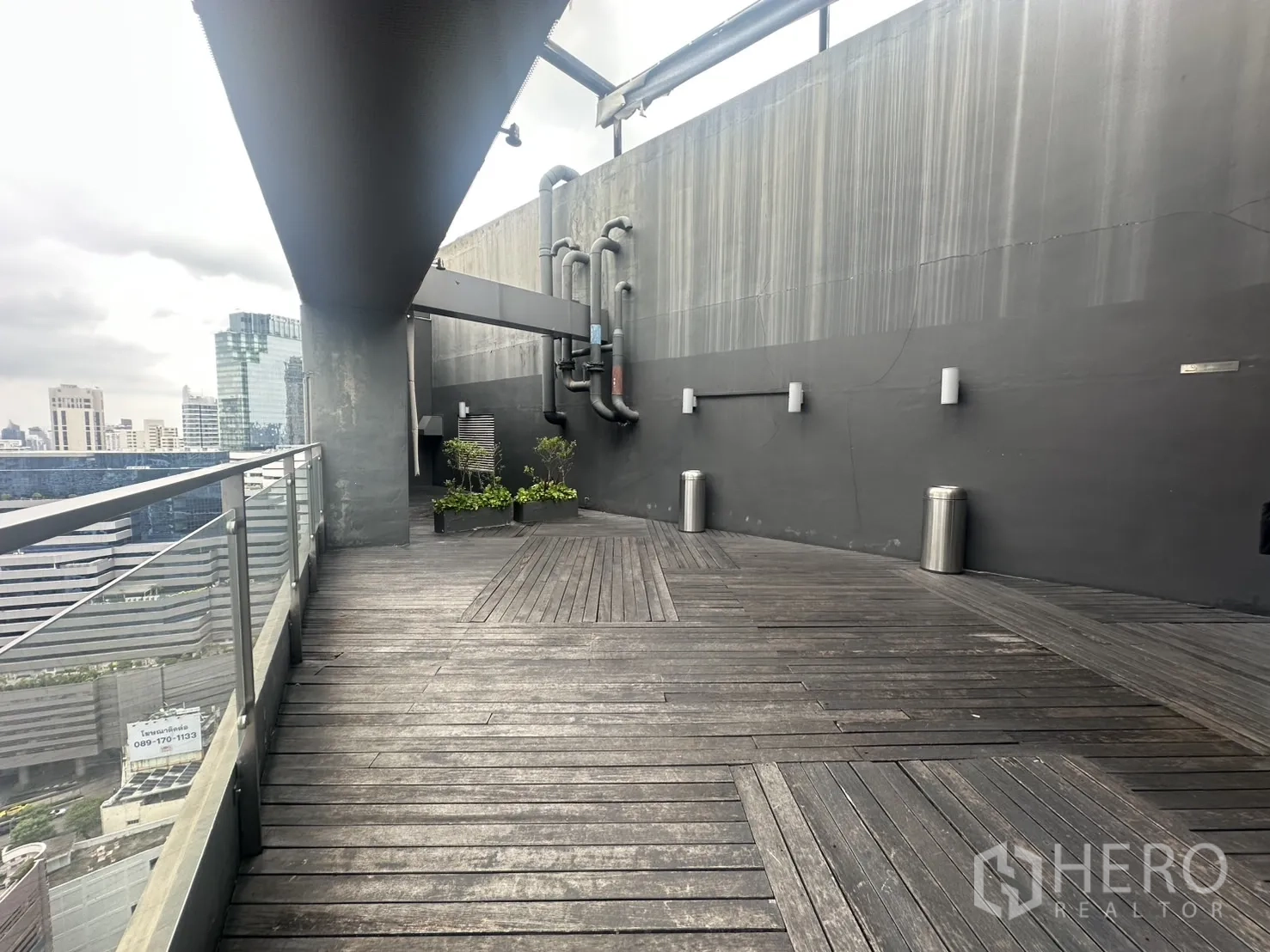 Retail Space for rent in Khlong Toei, Bangkok - Spacious outdoor deck with railing and utility wall details.