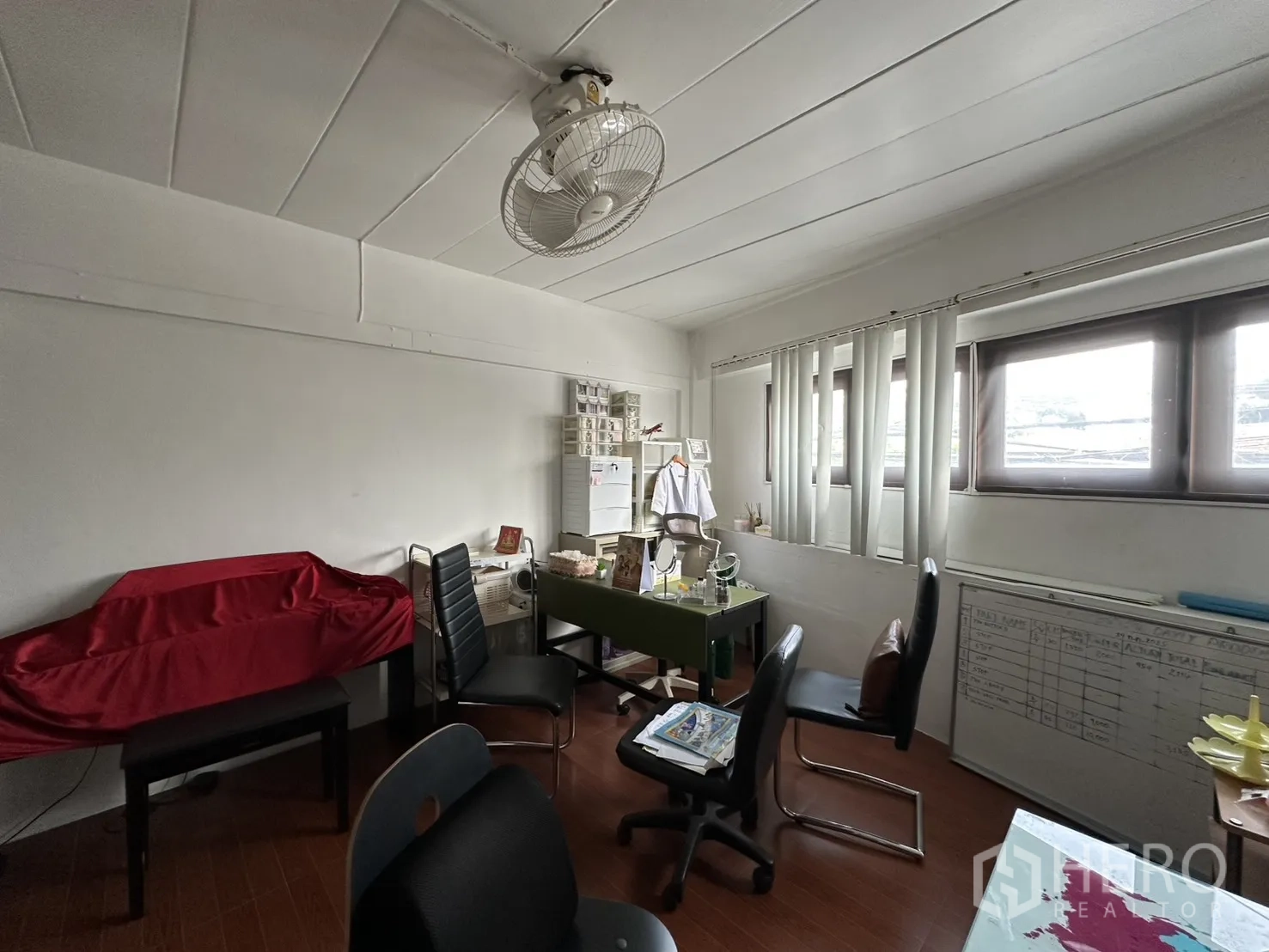Shophouse for rent in Phra Khanong, Bangkok - Another view of office space with windows and ceiling fan.