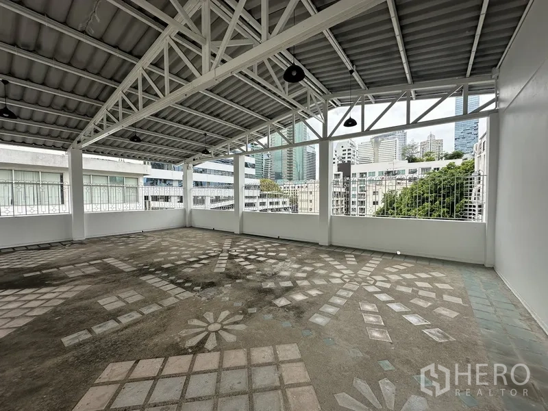 Retail Space for rent in Bang Rak, Bangkok - Expansive covered terrace with steel beams and patterned floor tiles.