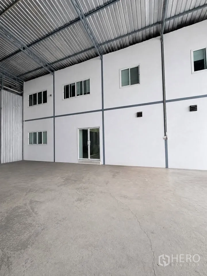 Warehouse for rent in Bang Khun Thian, Bangkok - Internal office block inside the warehouse with sliding glass door and windows.