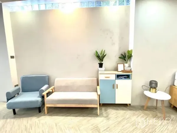 Retail Space for rent in Watthana, Bangkok - Bright lounge area of an open-plan retail space in Watthana with pastel sofas, storage cabinet and indoor plants.