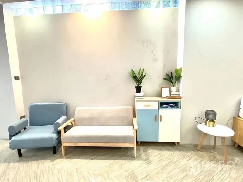Retail Space for rent in Watthana, Bangkok - Bright lounge area of an open-plan retail space in Watthana with pastel sofas, storage cabinet and indoor plants.