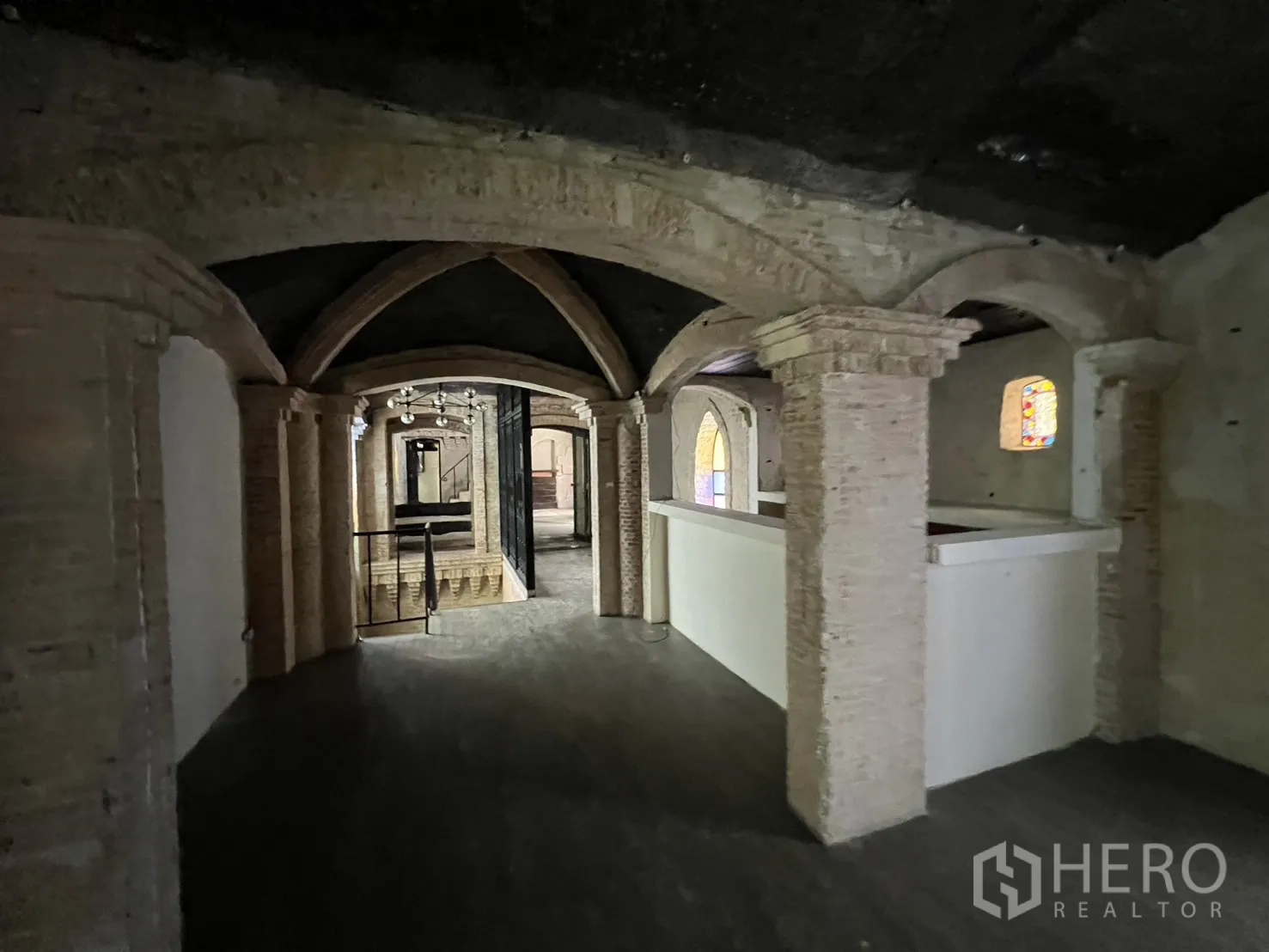 Retail Space for rent in Watthana, Bangkok - Long gallery of brick arches leading toward a chandelier-lit section.